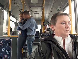 Lindsey Olsen pounds her stud on a public bus